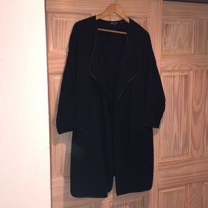 Long black knit coat with faux leather trim